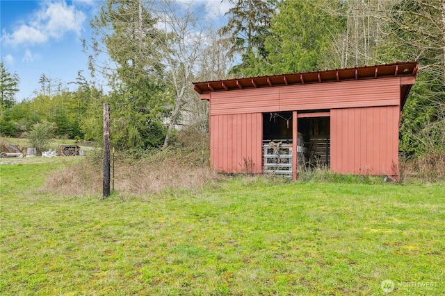 view of pole building with a lawn