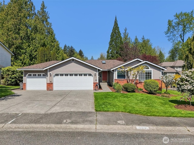 ranch-style house featuring a front lawn, concrete driveway, an attached garage, and brick siding