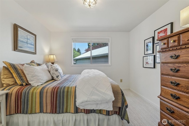 carpeted bedroom with baseboards