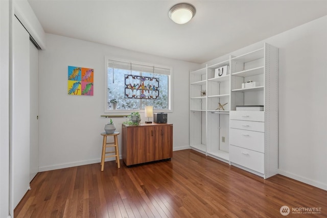 interior space with hardwood / wood-style flooring and baseboards