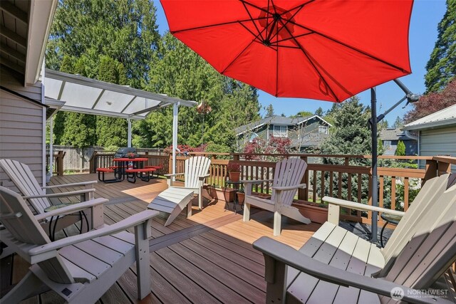 wooden deck with outdoor dining space