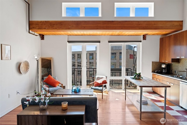 1408 12th Ave Unit 507, Seattle, WA 98122 - living room with beam ceiling and light wood finished floors