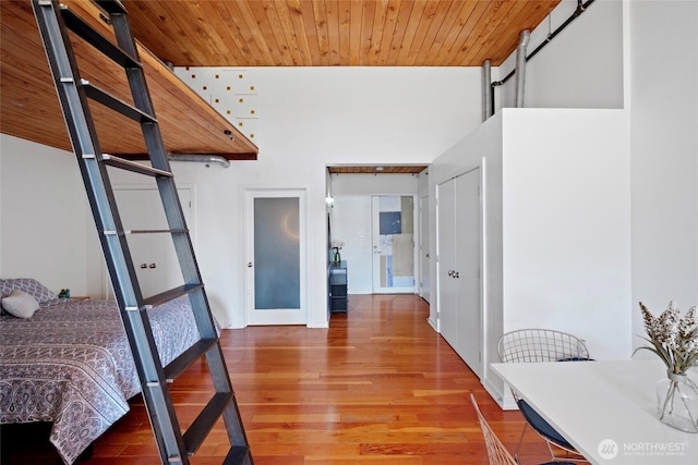 1408 12th Ave Unit 507, Seattle, WA 98122 - bedroom featuring wood finished floors, a barn door, and wooden ceiling