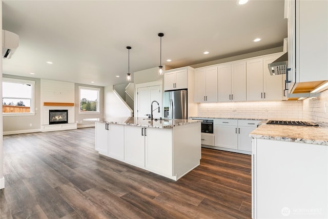 kitchen featuring tasteful backsplash, stainless steel appliances, and dark wood finished floors