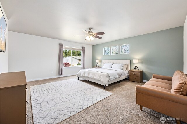 bedroom featuring baseboards, a ceiling fan, and carpet