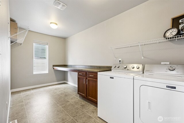 laundry room with separate washer and dryer, baseboards, cabinet space, and visible vents