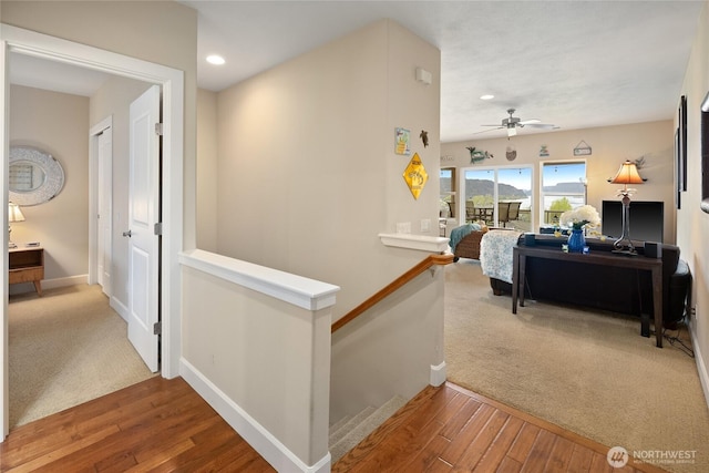 23154 Sunserra Loop NW Unit B15, Quincy, WA 98848 - hall featuring recessed lighting, baseboards, hardwood / wood-style flooring, and an upstairs landing