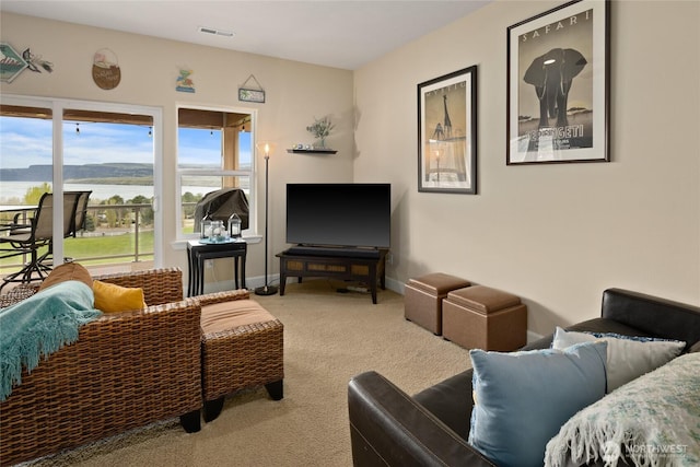 23154 Sunserra Loop NW Unit B15, Quincy, WA 98848 - living area with visible vents, baseboards, and light carpet