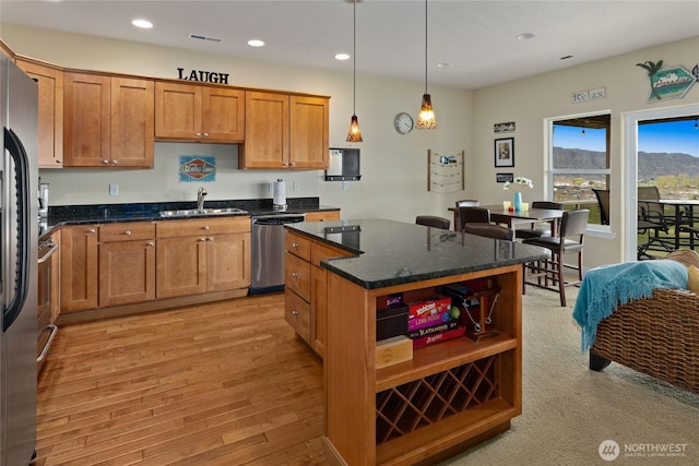 23154 Sunserra Loop NW Unit B15, Quincy, WA 98848 - kitchen with stainless steel appliances, a sink, light wood-type flooring, recessed lighting, and open shelves