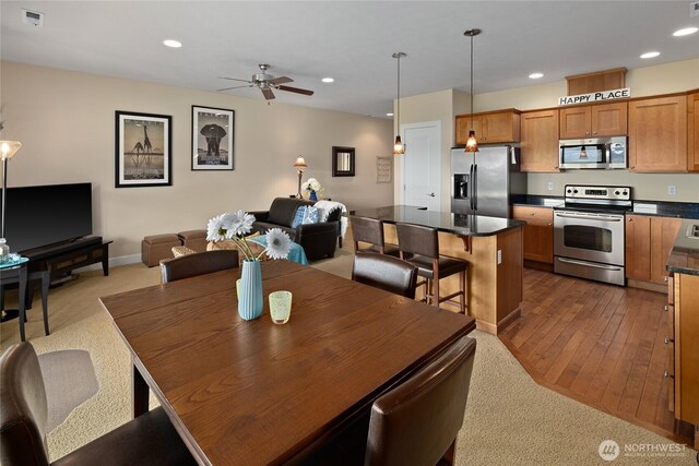 23154 Sunserra Loop NW Unit B15, Quincy, WA 98848 - dining area with dark colored carpet, baseboards, visible vents, recessed lighting, and a ceiling fan