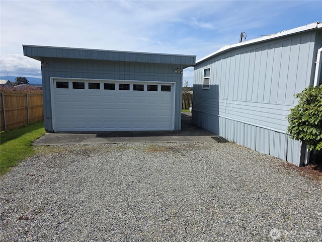 detached garage with fence