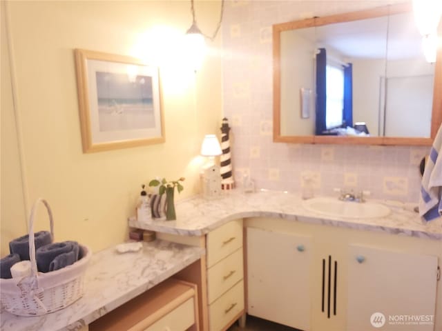 bathroom with backsplash and vanity