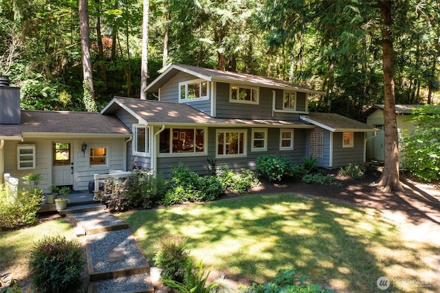 4657 Island Ave NE, Bainbridge Island, WA 98110 - view of front facade featuring a front yard and a chimney
