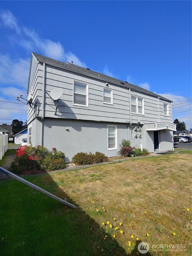 1700 California Ave S, Long Beach, WA 98631 - back of house with a yard and stucco siding