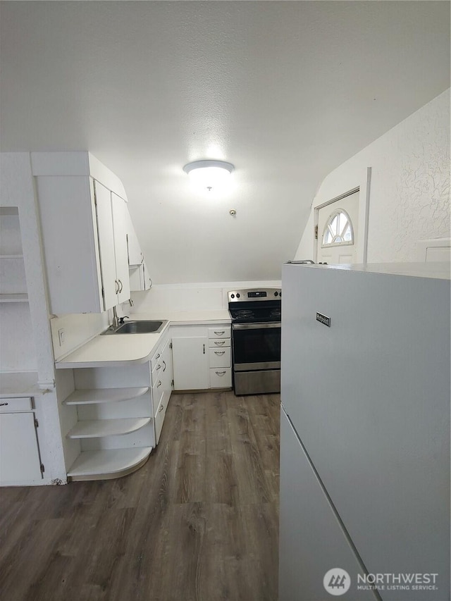 1700 California Ave S, Long Beach, WA 98631 - kitchen featuring freestanding refrigerator, dark wood-type flooring, open shelves, a sink, and electric stove