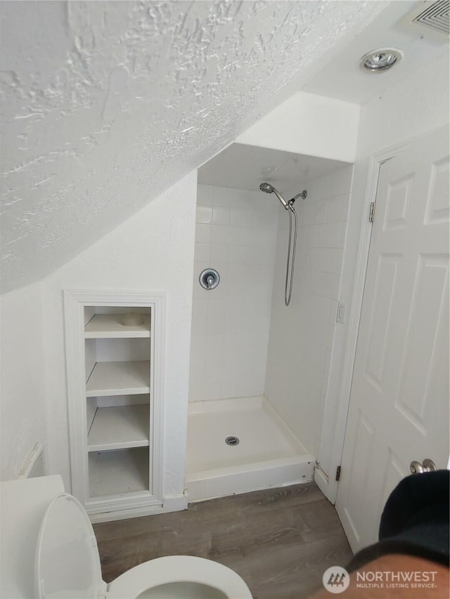 1700 California Ave S, Long Beach, WA 98631 - full bathroom with built in features, a shower stall, visible vents, toilet, and wood finished floors