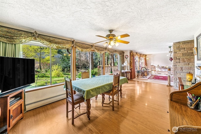 sunroom featuring baseboard heating