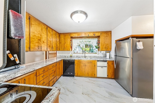 kitchen featuring freestanding refrigerator, black dishwasher, marble finish floor, a sink, and brown cabinets