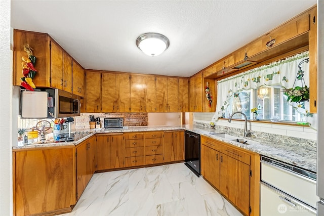kitchen featuring brown cabinets, dishwasher, a sink, and backsplash