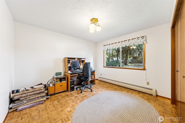 office area with baseboards and a baseboard heating unit