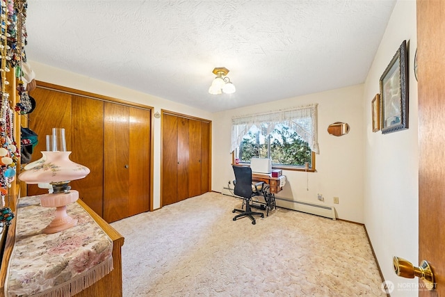 carpeted home office with a textured ceiling and a baseboard heating unit