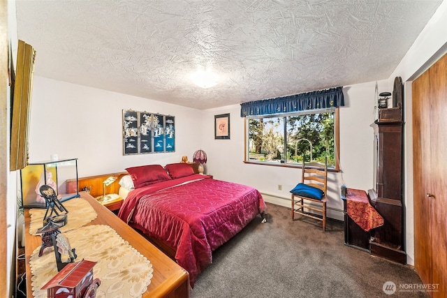 carpeted bedroom featuring wood walls, a textured ceiling, and baseboard heating