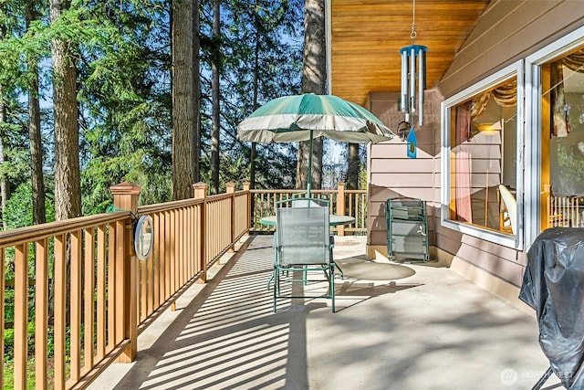 exterior space with area for grilling and outdoor dining area