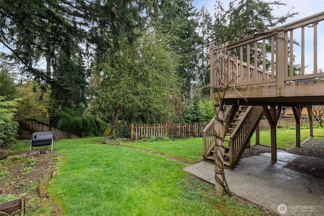 1210 108th Ave SE, Bellevue, WA 98004 - view of yard featuring a wooden deck, fence, a patio, and stairs