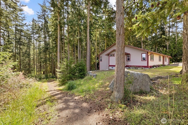 view of home's exterior with a detached garage