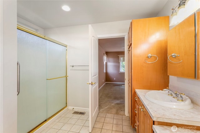 full bathroom featuring tile patterned flooring, a shower stall, vanity, baseboards, and recessed lighting