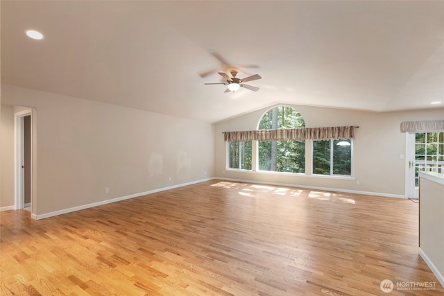 3912 Holcomb Prt, Townsend, WA 98368 - unfurnished living room with lofted ceiling, ceiling fan, light wood-style flooring, and baseboards