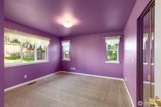 3912 Holcomb Prt, Townsend, WA 98368 - carpeted empty room featuring healthy amount of natural light and baseboards