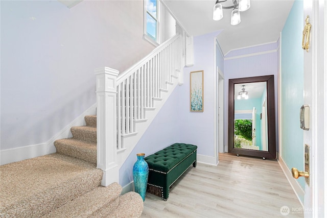 819 NW 50th St, Seattle, WA 98107 - foyer entrance featuring light wood-style flooring, baseboards, and stairway