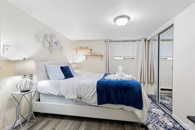819 NW 50th St, Seattle, WA 98107 - bedroom featuring wood finished floors and a closet