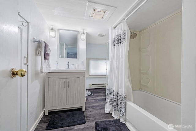 819 NW 50th St, Seattle, WA 98107 - bathroom with shower / tub combo, vanity, baseboard heating, visible vents, and wood finished floors