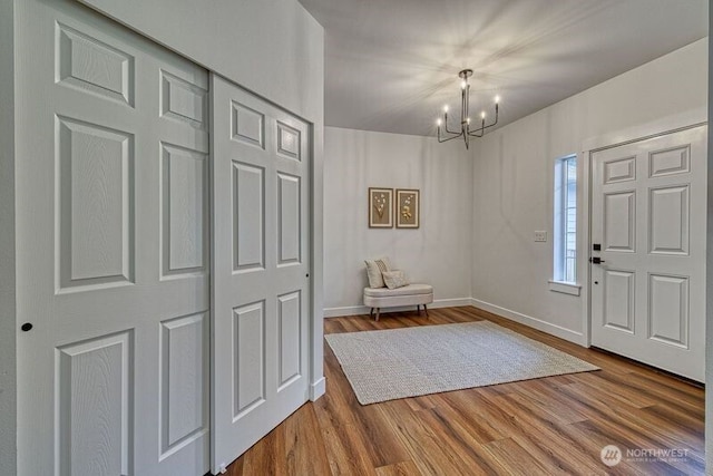 2822 200th Ave SW, Lakebay, WA 98349 - foyer entrance featuring a chandelier, wood finished floors, and baseboards