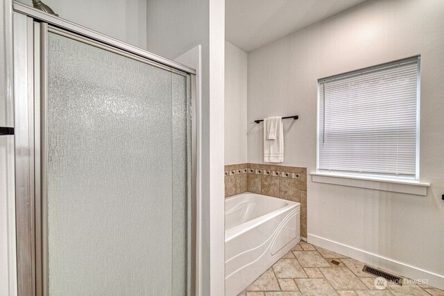 2822 200th Ave SW, Lakebay, WA 98349 - full bath with baseboards, a stall shower, a garden tub, and stone tile flooring