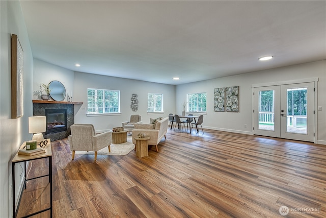 2822 200th Ave SW, Lakebay, WA 98349 - living room featuring wood finished floors, a fireplace, recessed lighting, french doors, and baseboards
