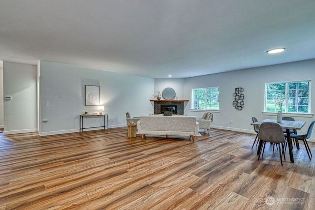 2822 200th Ave SW, Lakebay, WA 98349 - living area with wood finished floors, a glass covered fireplace, baseboards, and recessed lighting