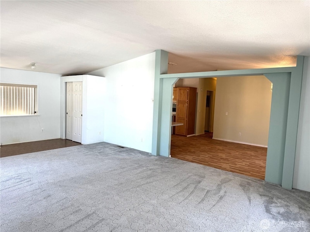 3010 W Peninsula Dr Unit 109, Moses Lake, WA 98837 - spare room featuring arched walkways and carpet floors