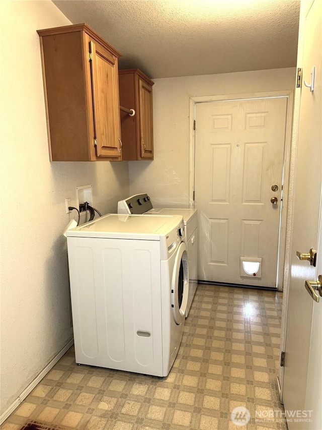 3010 W Peninsula Dr Unit 109, Moses Lake, WA 98837 - washroom featuring light flooring, independent washer and dryer, cabinet space, and a textured ceiling