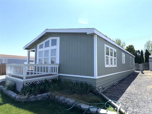 3010 W Peninsula Dr Unit 109, Moses Lake, WA 98837 - view of side of property featuring a deck