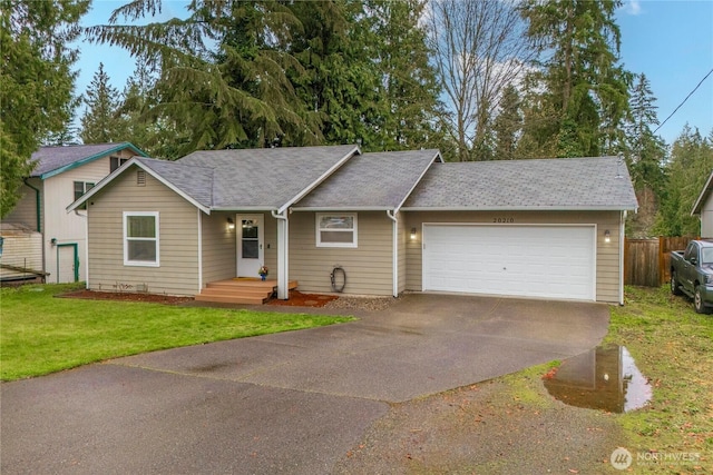 20210 La Paloma Dr E, Bonney Lake, WA 98391 - ranch-style home with a front yard, fence, an attached garage, a shingled roof, and driveway
