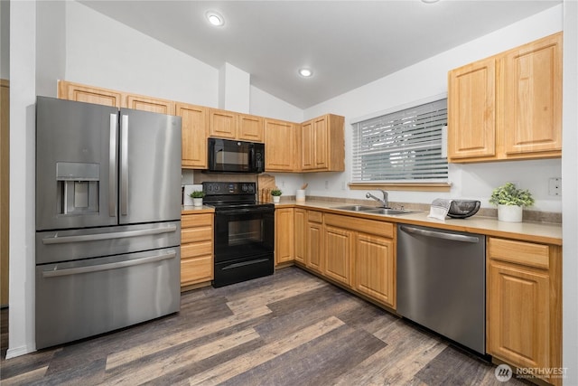20210 La Paloma Dr E, Bonney Lake, WA 98391 - kitchen featuring light countertops, a sink, lofted ceiling, and black appliances
