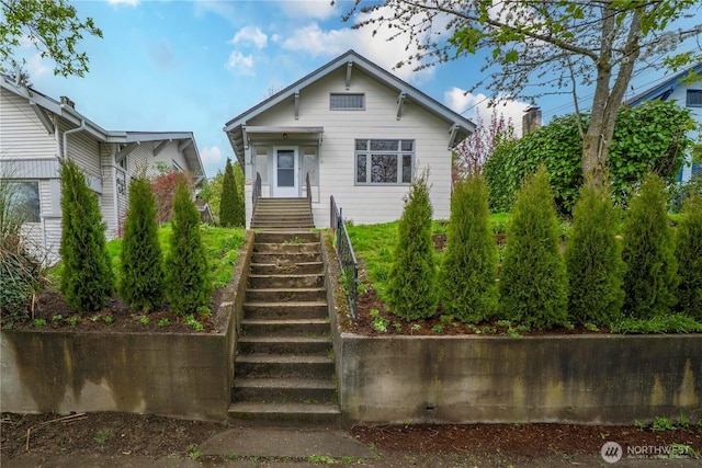 view of front of house with stairs