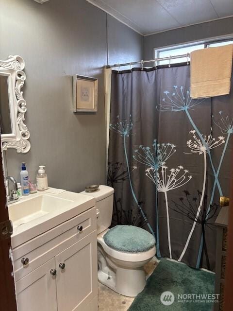6210 105th Ave Court E Unit 67, Puyallup, WA 98372 - bathroom featuring toilet, a shower with shower curtain, tile patterned flooring, vanity, and crown molding