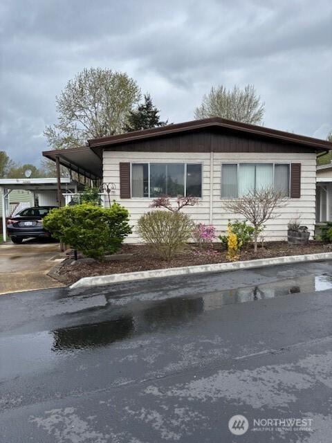 6210 105th Ave Court E Unit 67, Puyallup, WA 98372 - view of front of property featuring driveway and a carport