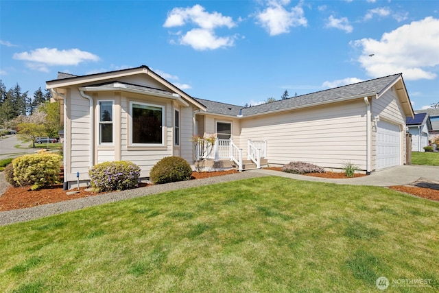 ranch-style home featuring a front yard, driveway, and an attached garage