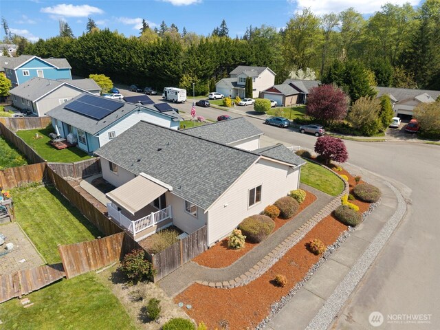 birds eye view of property with a residential view