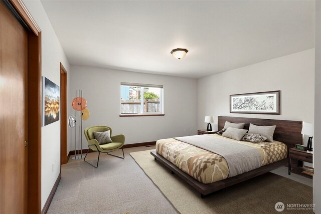 carpeted bedroom with baseboards